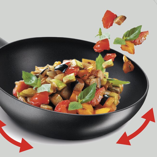 Vad är skillnaden mellan en wok och en traktörpanna?